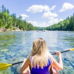 Young woman sea kayaking