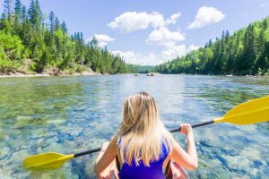 Young woman sea kayaking