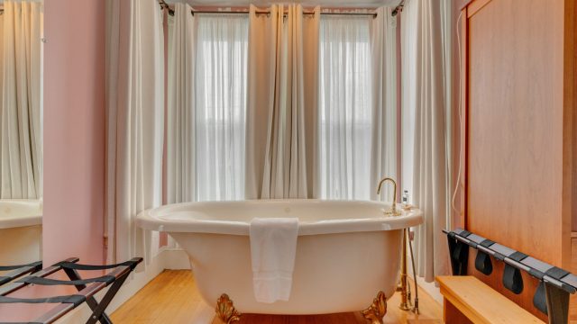 clawfoot tub in wisteria room