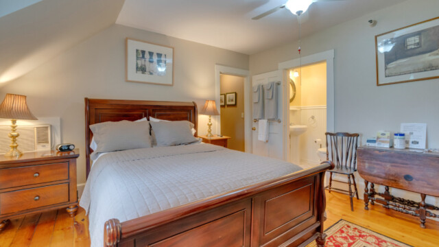 View of bed in taupe room
